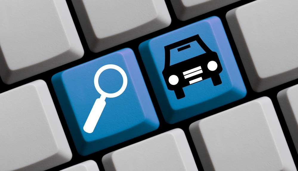 Why is it important to check vehicle history before buying a used car?